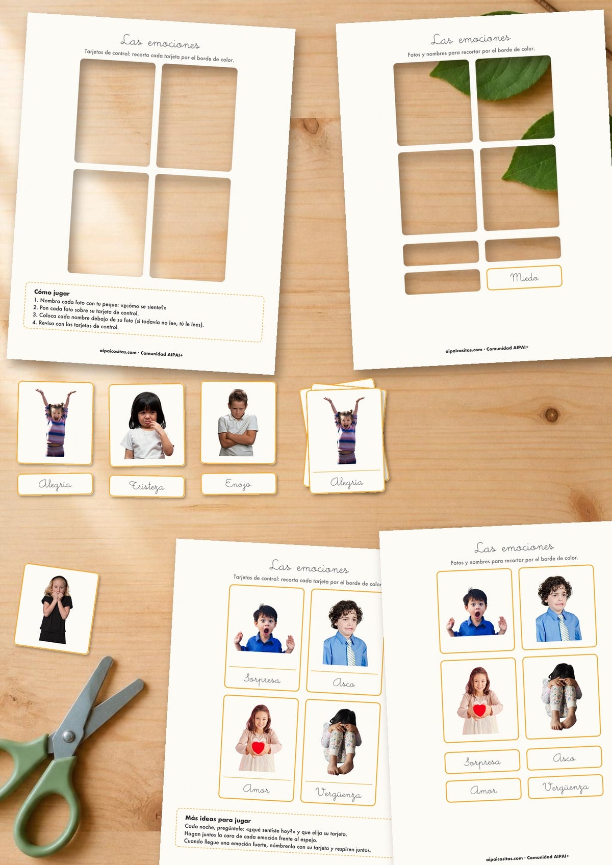 Tarjetas de las emociones de AIPAI recortadas sobre la mesa, con fotos de niños alegres, tristes y enojados