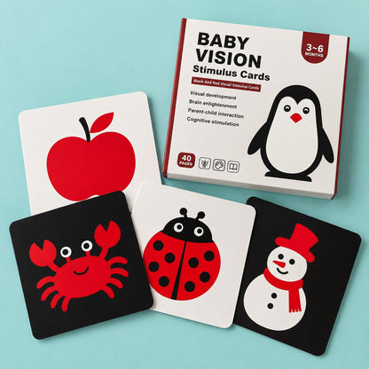 Set 3-6 meses: caja y tarjetas en negro y rojo con manzana, cangrejo, catarina y muñeco de nieve