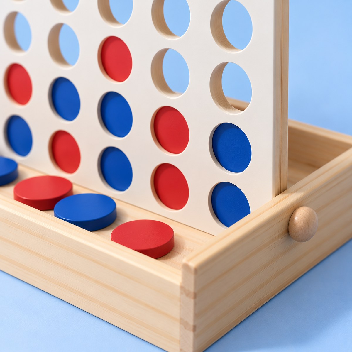 Detalle: la perilla de la caja, eje de la rejilla que se pliega para guardar el juego